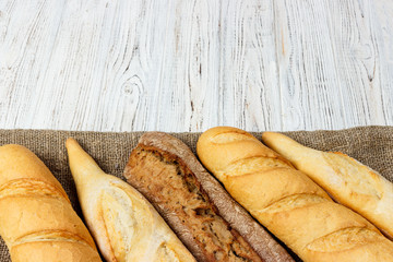 French baguette on the kitchen table. Close-up