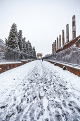 A lovely day of snow in Rome, Italy, 26th February 2018: a beautiful view of Via Sacra and Arch of Tito near Colosseum under the snow