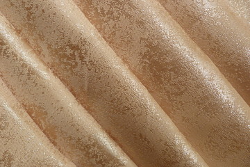 gold fabric brocade close-up taffeta silk tapestry natural fabric background for decoration...