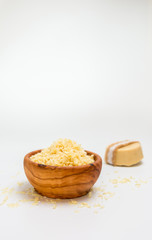 SOAP in a bowl of wood flakes. This SOAP is handmade.