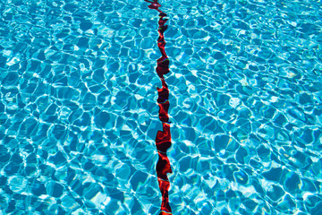 Abstract blue background with a red stripe in the middle. Water in the pool