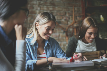 Three girls in cafe.