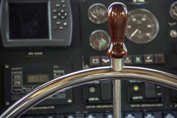 Steering wheel and instrument panel in a motor yacht cockpit © DeStefano