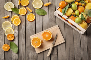 Citrus fruits on a wooden table, ready to be squeezed