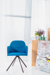 Blue modern chair in stylish room