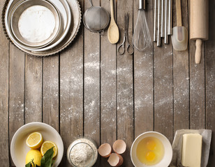Ingredients and kitchen tools on a wooden table
