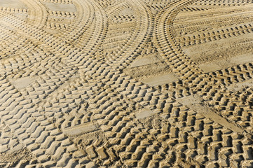 Tractor tracks and machine traces in the sand