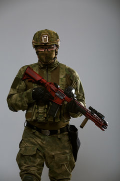 Picture of military man in helmet with gun