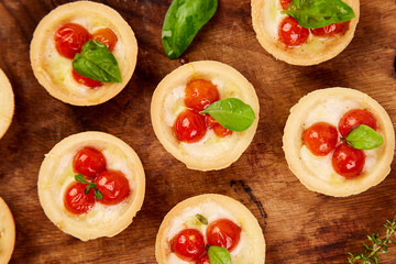 Mini tarts with cherry tomatoes