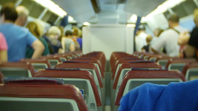 Walk to the exit with aircraft passengers after landing. 4k
