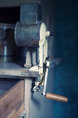 vintage metal kitchen appliance on wooden table