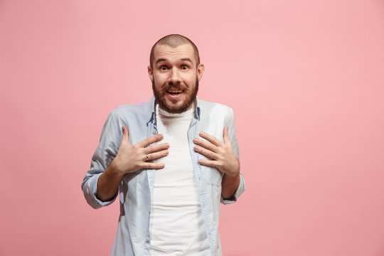 Let me think. Doubtful pensive man with thoughtful expression making choice against pink background