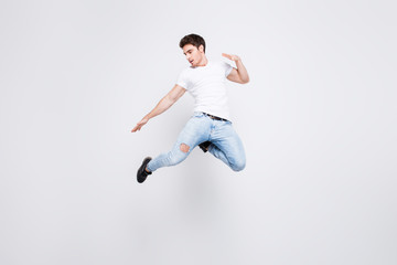 Fototapeta na wymiar Success win winner achievement goal lifestyle leisure sexy people person cool swag people person concept. Full-length full-size portrait of attractive muscular guy jumping up isolated gray background