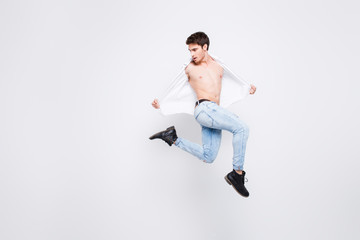 Fototapeta na wymiar Free celebrate legs happiness people person win winner luck vogue concept. Full-length full-size portrait of handsome attractive with haircut wearing denim trousers guy isolated on gray background