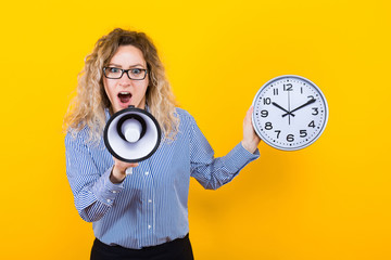 Woman in shirt with clocks and loudspeaker
