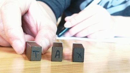 word tax on table office finance. 