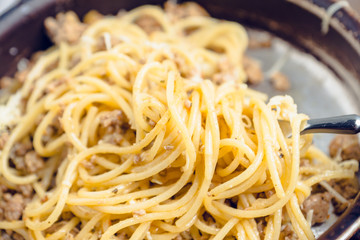 Fresh pasta with meat and cheese. Selective focus.