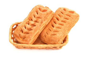 Fresh puff pie buns in wicker basket