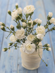flowers white carnations on a wooden background. 