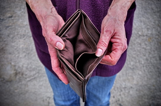 Empty wallet in the hands of an elderly woman.Global poverty. A financial crisis .
