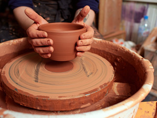 production process of pottery. A cut of a clay cup from a potter's wheel.