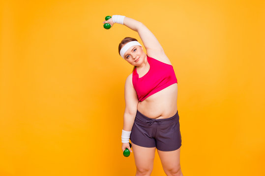 Young woman in exercise clothes with hand weights