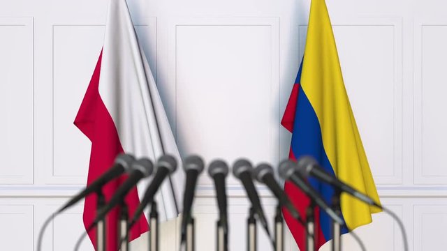 Flags of Poland and Colombia at international meeting or negotiations press conference