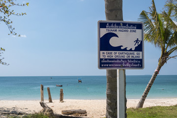 tsunami signboard in the beach, thailand, ko lanta island