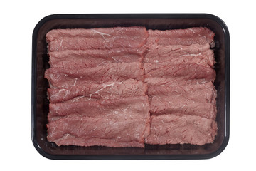 Supermarket plastic tray with veal isolated on white background. Top view
