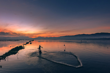 Fisherman's dancing on the water in sunrise view