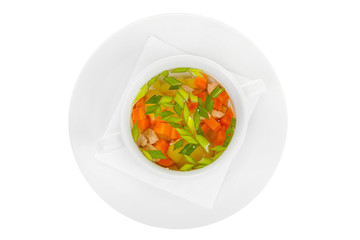 Soup of the ear, transparent with chicken, fish in white plate isolated white. On a napkin, with greens, carrots. Serving dishes in a cafe, restaurant, for a menu. View from above
