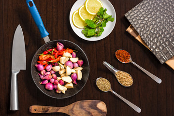 Raw ingredients - herbs and spices lay flat image on wooden table top