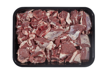 Plastic tray with lamb meat isolated on white background. Top view
