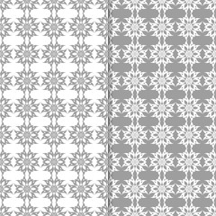 White and gray set of floral seamless patterns