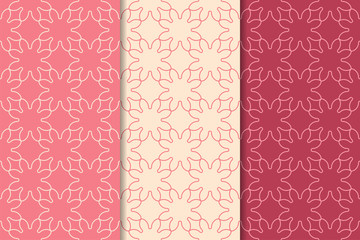 Set of geometric ornaments. Cherry red seamless patterns