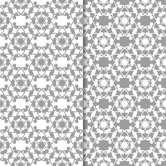 White and gray floral backgrounds. Set of seamless patterns