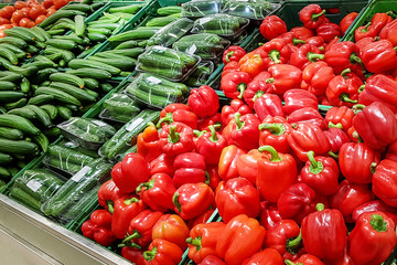 Fresh Vegetables in supermarket: pepper, cucumbers, tomato. farmers market. Healthy food. Vitamins and minerals.