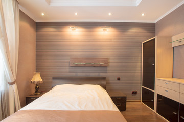 bedroom in brown design with ceiling lighting front view