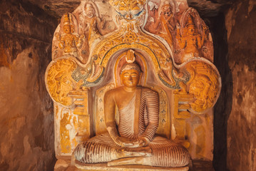 Stone figure of meditating Buddha inside the 14th century buddhist temple