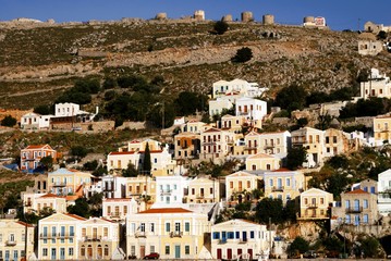 Fototapeta na wymiar Houses in Yalos, the port of Symi. Syni island, Dodecanese islands, Greece.