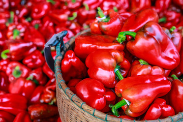 The bell pepper in the bamboo basket.