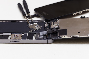 Close-up photos showing process of mobile phone repair