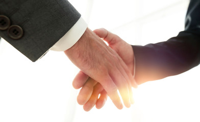 Two  business men going to make handshake