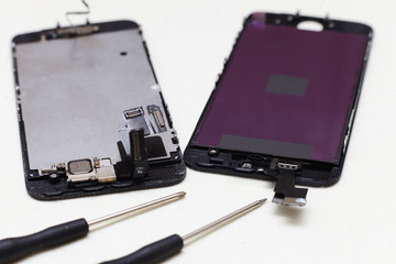 Close-up photos showing process of mobile phone repair