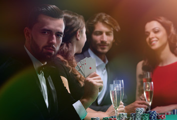 Handsome man playing in casino