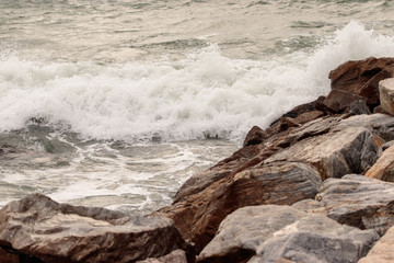 Waves breaking over rocks