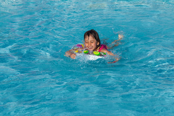 little girl in the swimming pool
