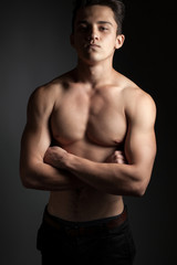 Fototapeta premium Athletic man on a black background