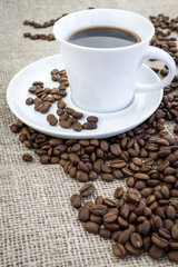 Cup of coffee in burlap
