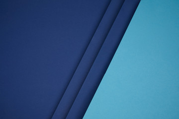 dark and bright blue geometric paper background